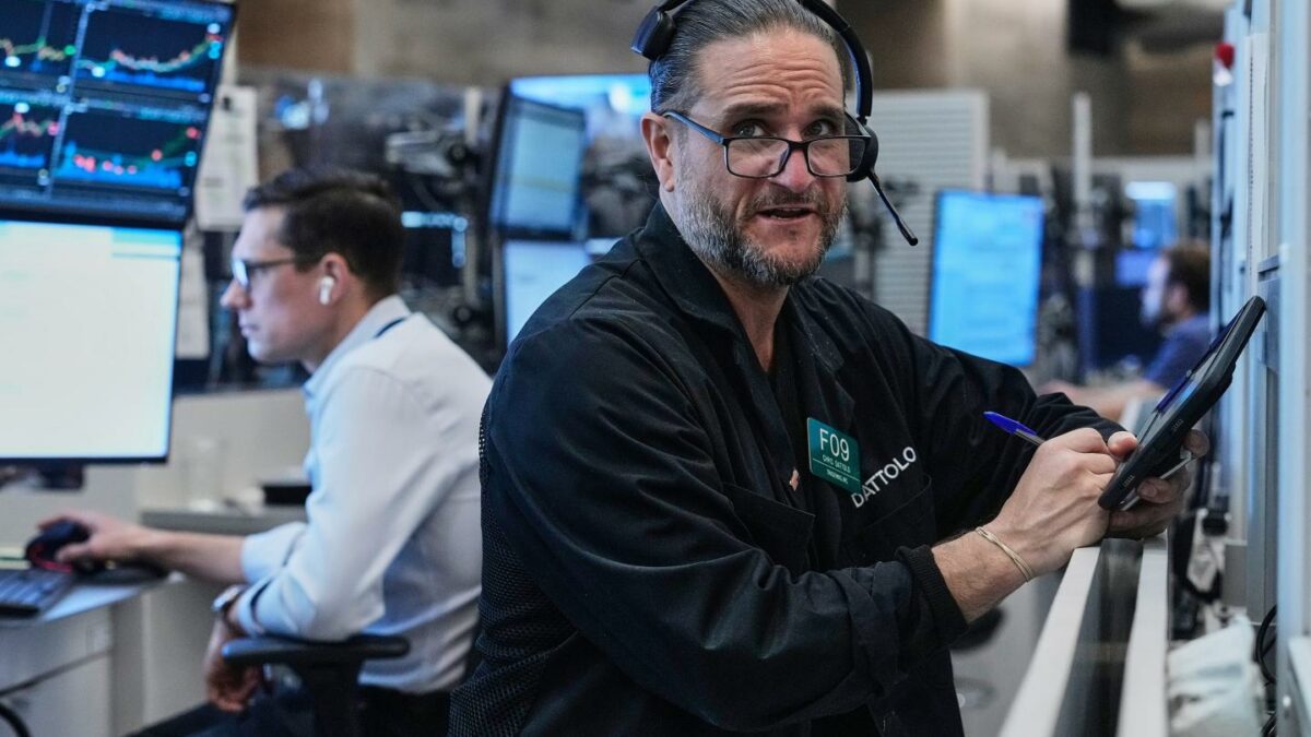Options trader Chris Daytona, right, works on the floor of the New York Stock Exchange, Wednesday, June 3, 2026.