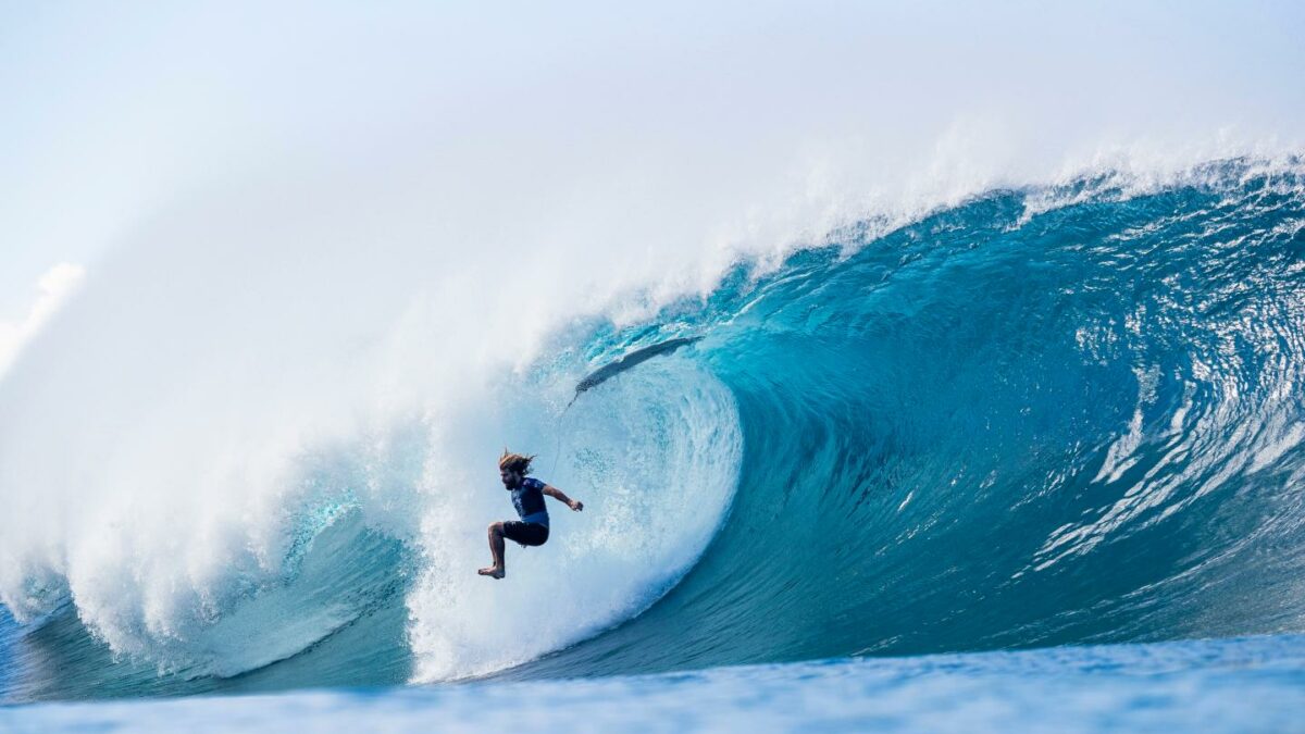 Photo of a surfer in a huge wave
