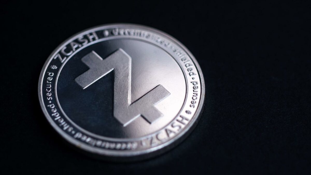 Studio shot of a silver zcash coin against a black backdrop.