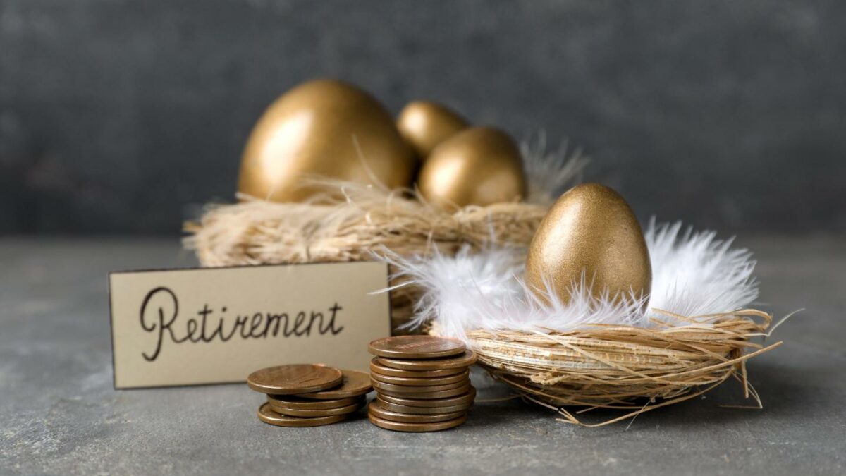 A nest of golden eggs with a sign that says Retirement.