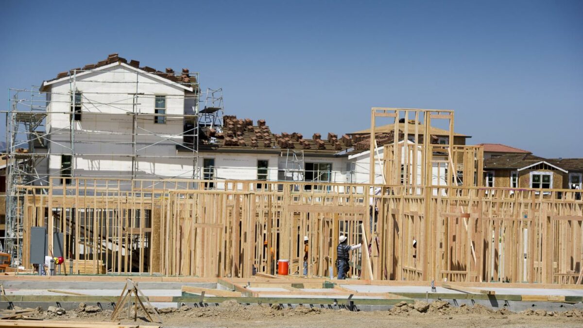 Contractors work on a new home under construction at Taylor Morrison Home Corp.'s La Solara Community in Dublin, California, on Tuesday, May 14, 2013.