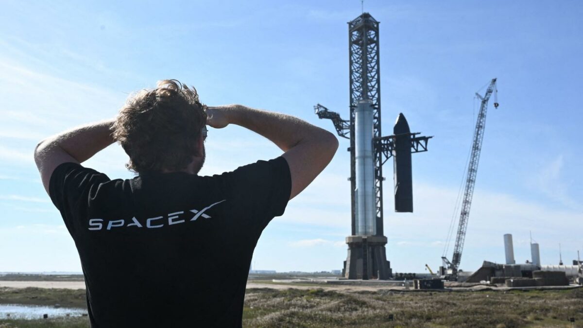 Man in t-shirt stares at rocket