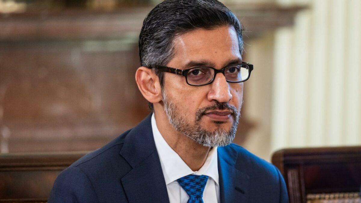 A man in a suit wearing glasses.