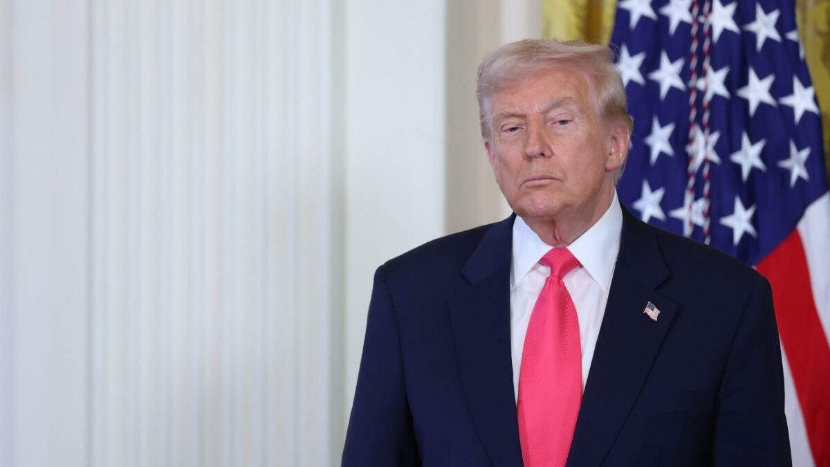 President Donald Trump listens as first lady Melania Trump speaks at a signing ceremony for the "Fostering the Future" executive order in the East Room of the White House on November 13, 2025 in Washington, DC.
