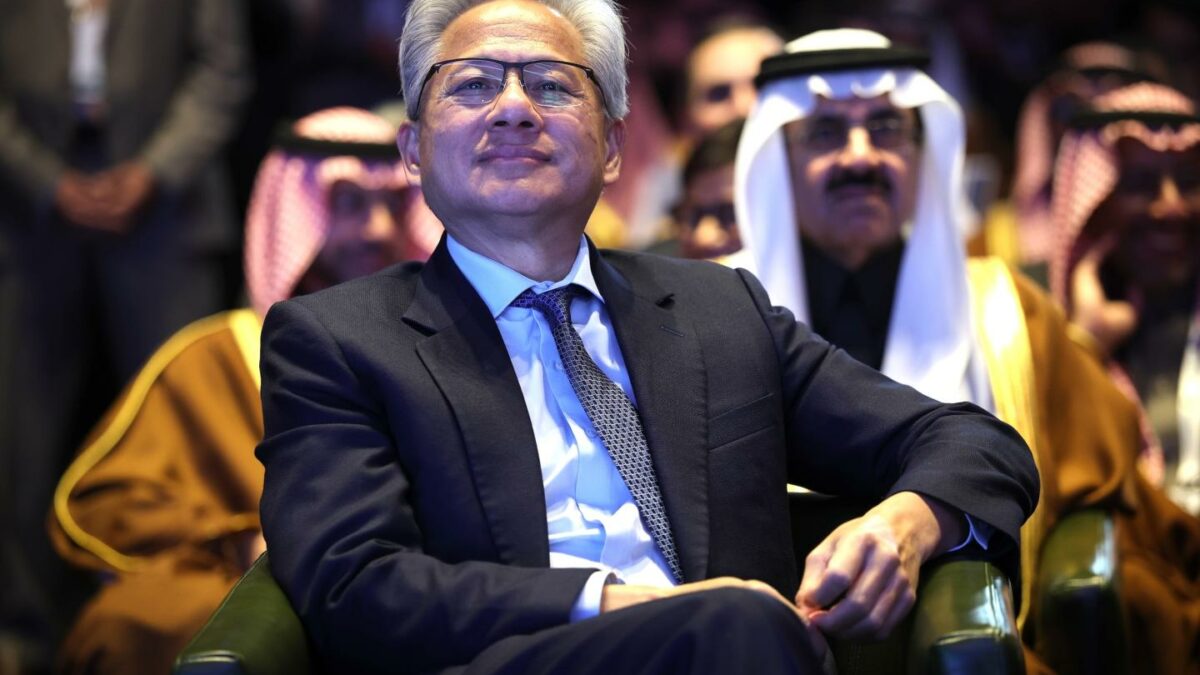 Photo: WASHINGTON, DC - NOVEMBER 19: Nvidia CEO Jensen Huang listens as U.S. President Donald Trump speaks at the U.S.-Saudi Investment Forum at the Kennedy Center on November 19, 2025 in Washington, DC. The forum is intended to bring together business leaders, innovators and political leaders with the goal of strengthening economic ties and promoting investment between the United States and Saudi Arabia.