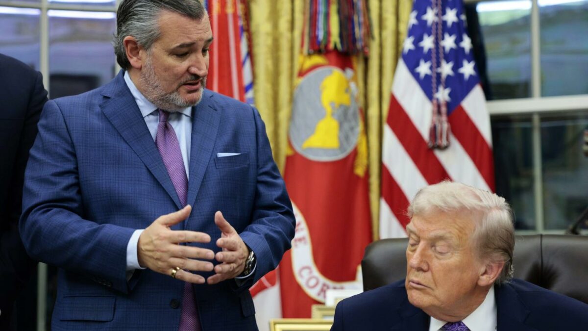 Ted Cruz stands and looks down at Donald Trump sitting at his desk in the Oval Office.