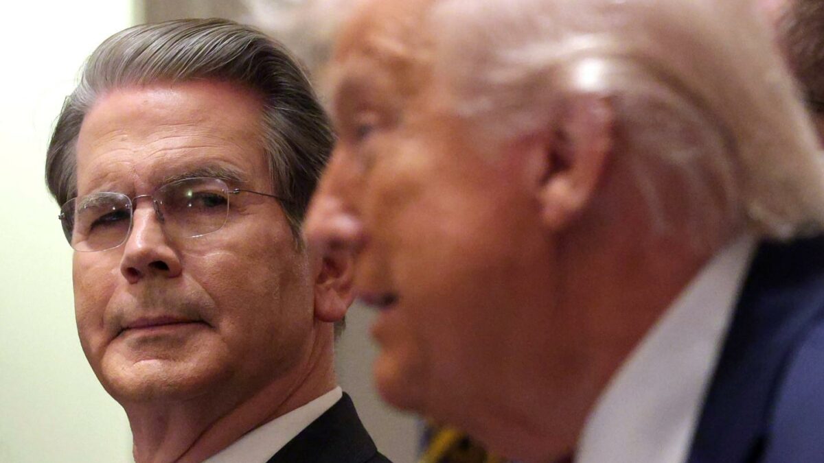 U.S. Treasury Secretary Scott Bessent looks on at U.S. President Donald Trump.