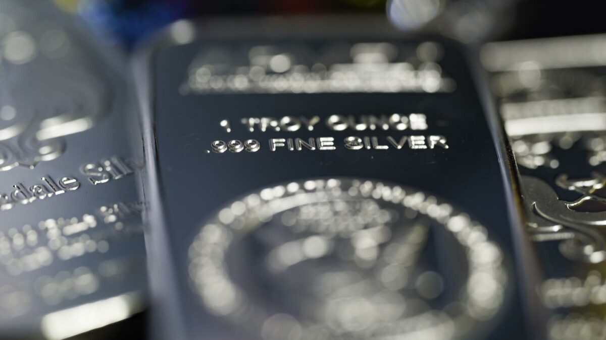 Silver pulls back after topping $80 in historic year-end rally