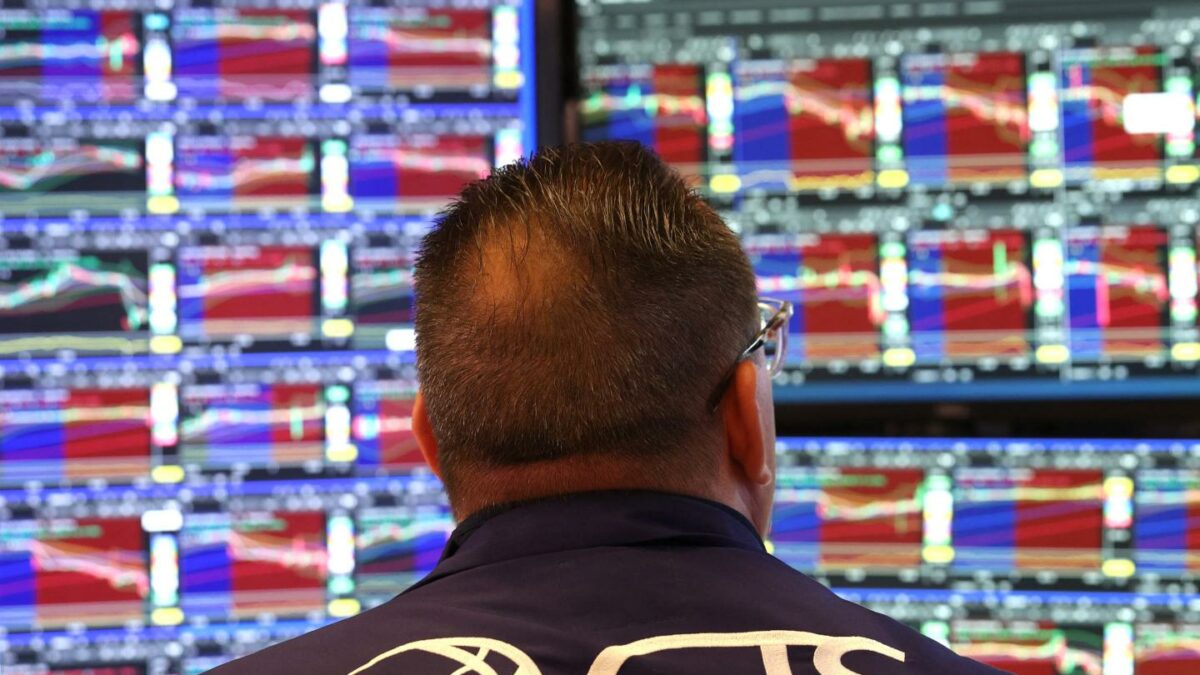 A trader works on the floor of the New York Stock Exchange (NYSE) after the opening bell in New York on January 7, 2026.