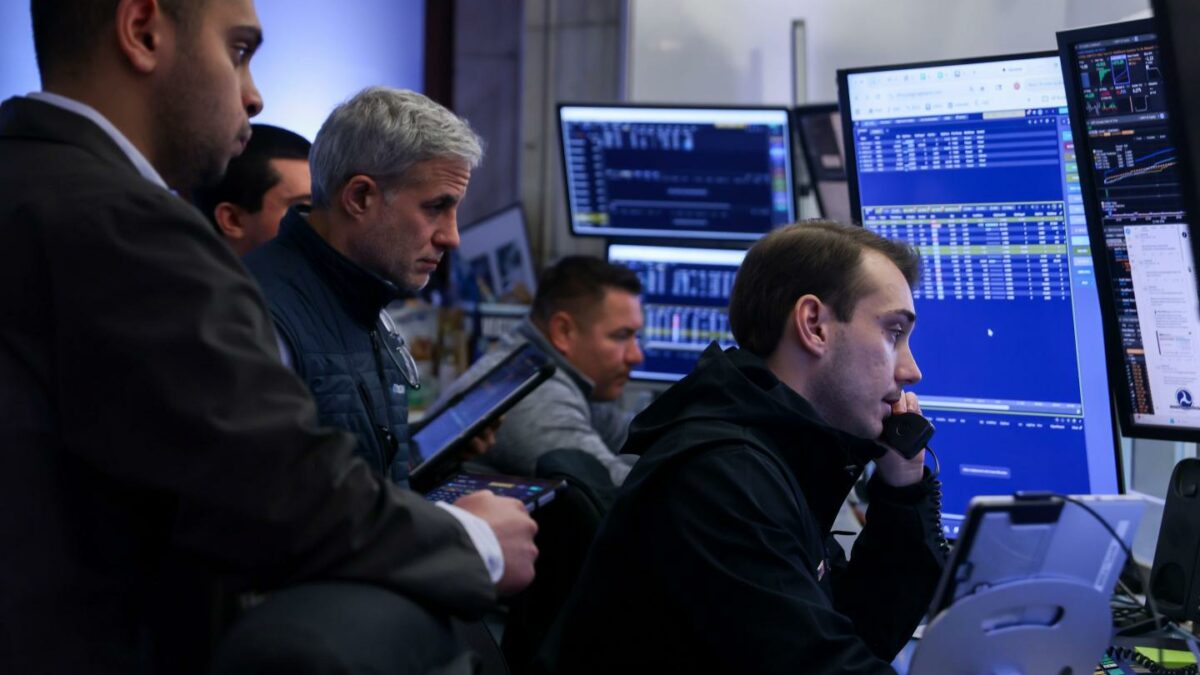 Traders work on the floor of the New York Stock Exchange on Wednesday, Feb. 11, 2026.