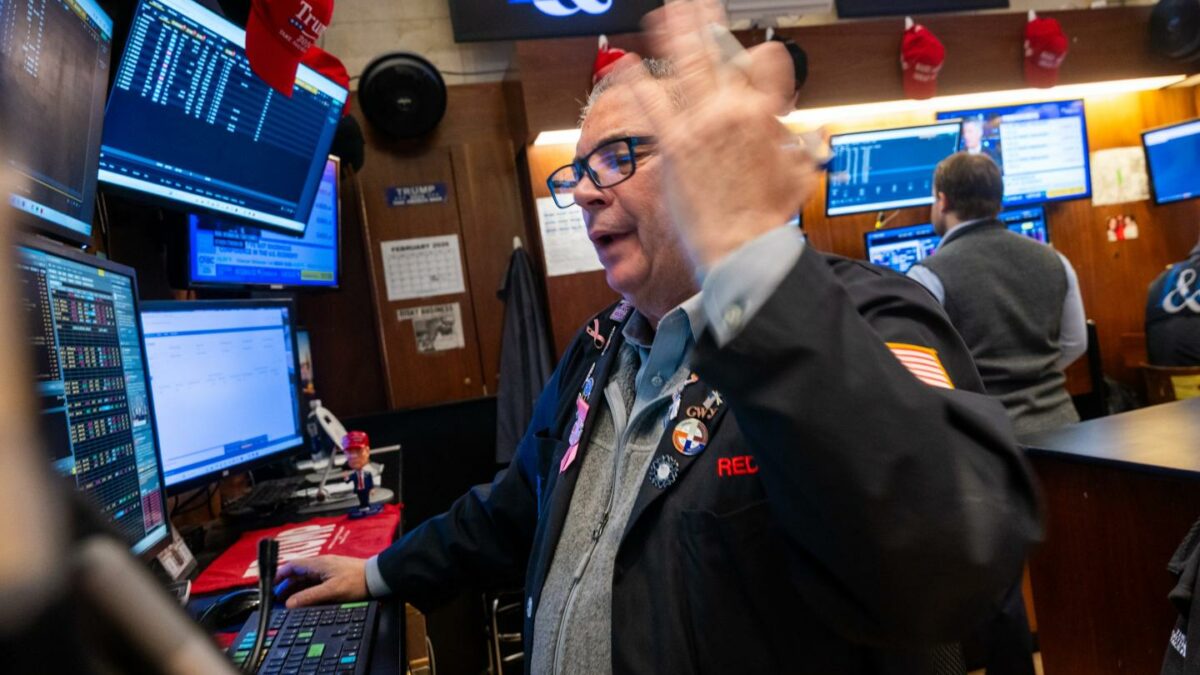 Traders work on the floor of the New York Stock Exchange on Feb. 13, 2026, in New York City.