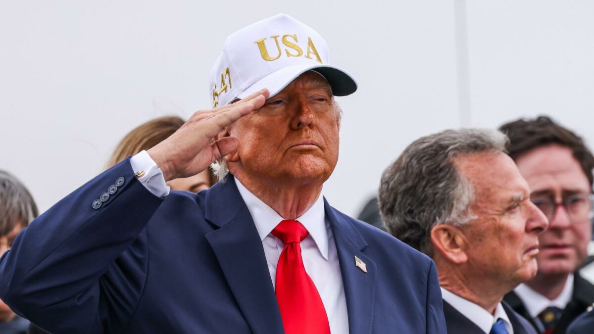 US President Donald Trump salutes during a dignified transfer at Dover Air Force Base in Dover, Delaware, US, on Saturday, March 7, 2026.