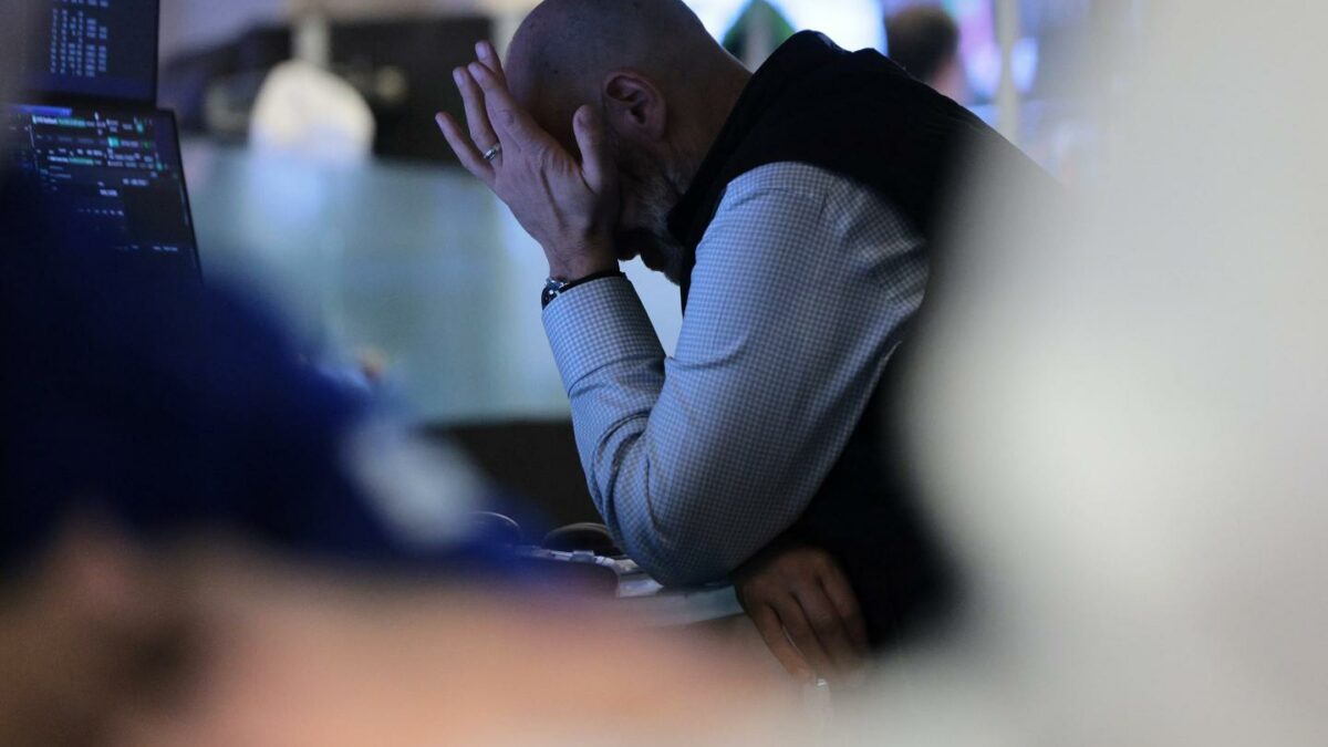 Traders work on the floor of the New York Stock Exchange during morning trading on March 25, 2026 in New York City.