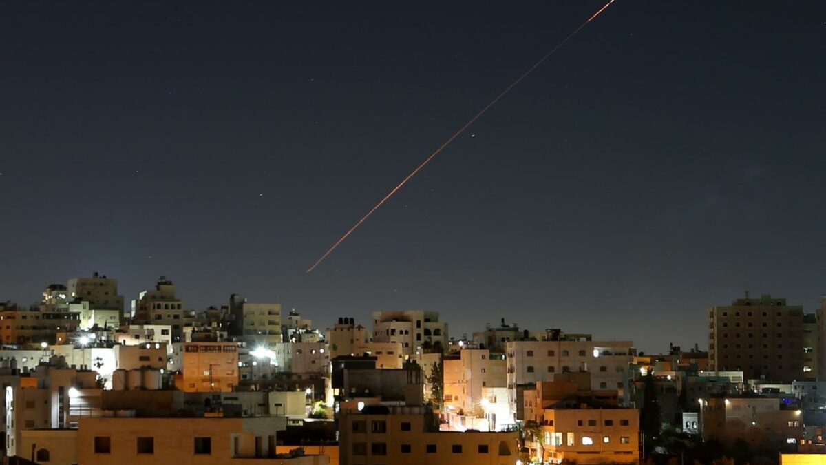 Missiles launched from Iran toward Israel are seen in the sky over the West Bank city of Hebron on June 7, 2026.