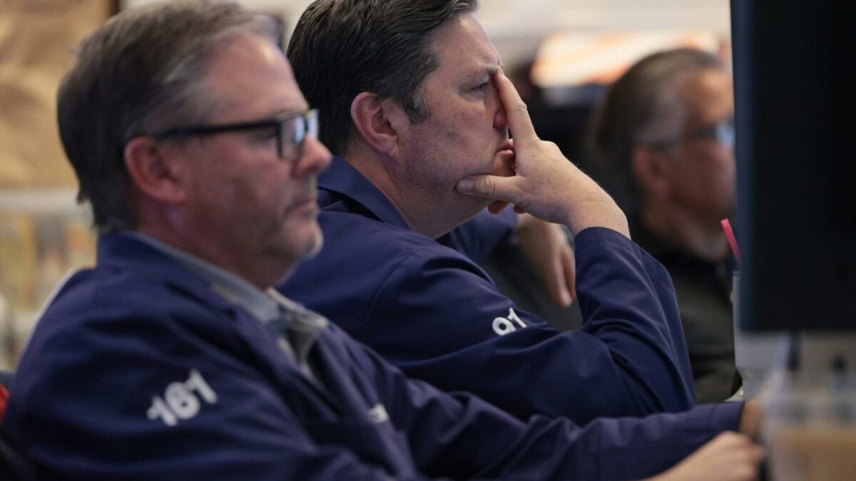 Traders work on the floor of the New York Stock Exchange during morning trading on July 1, 2026.