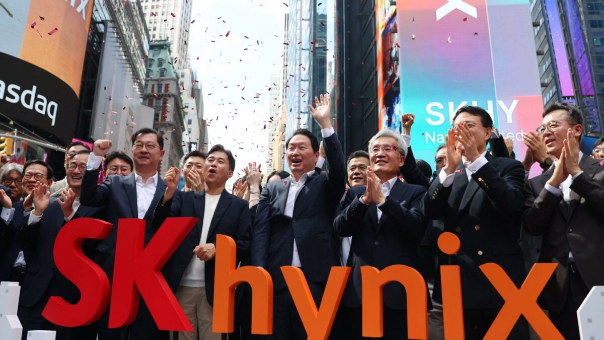 Chey Tae-won, chairman of SK Group, center, Kwak Noh-jung, president and chief executive officer of SK Hynix Inc., center left, and Koh Seung-beom, chairman of SK Hynix Inc., center right, during the company's initial public offering (IPO) at the Nasdaq MarketSite in New York, US, on Friday, July 10, 2026.