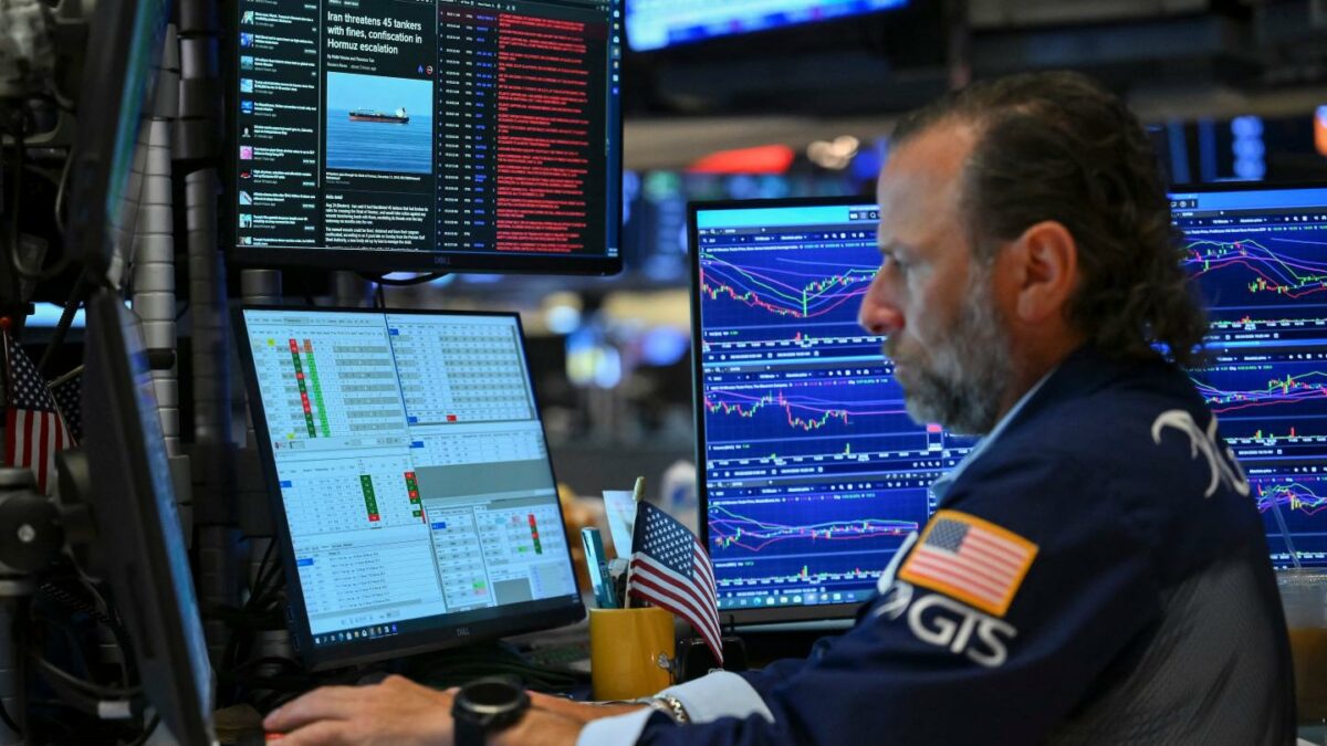 A trader works on the floor of the New York Stock Exchange.
