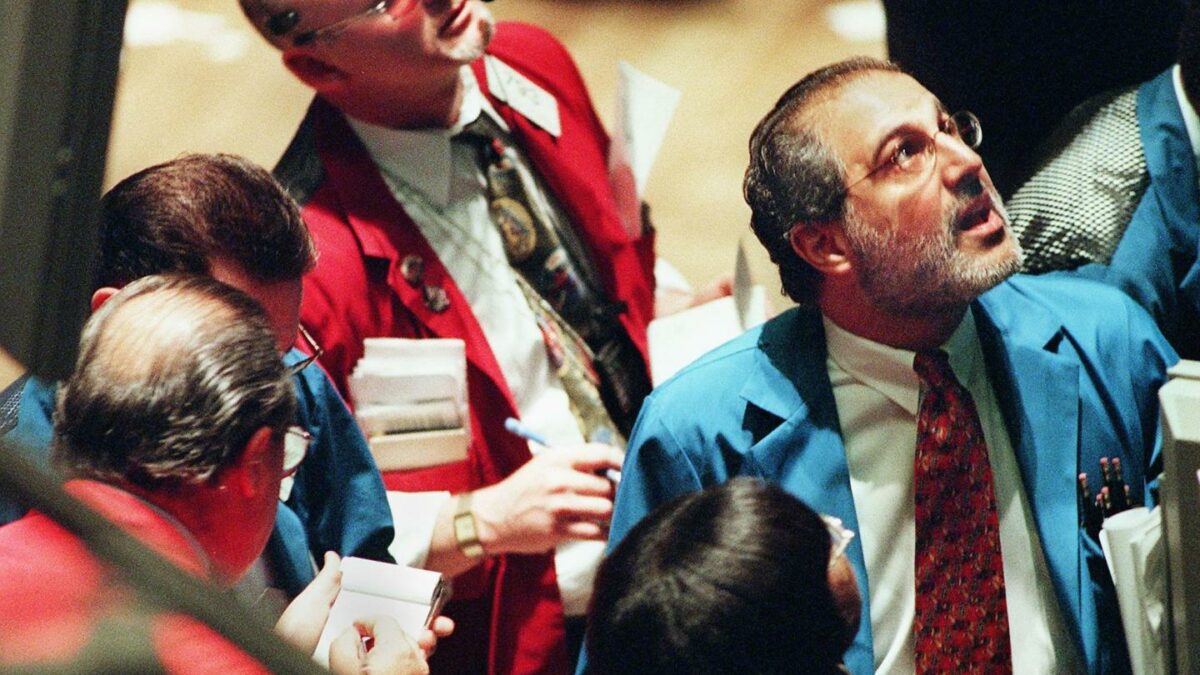 Traders on the floor of the New York Stock Exchange monitor the early moves of the market soon after the trading day began in New York 05 August, 1999.