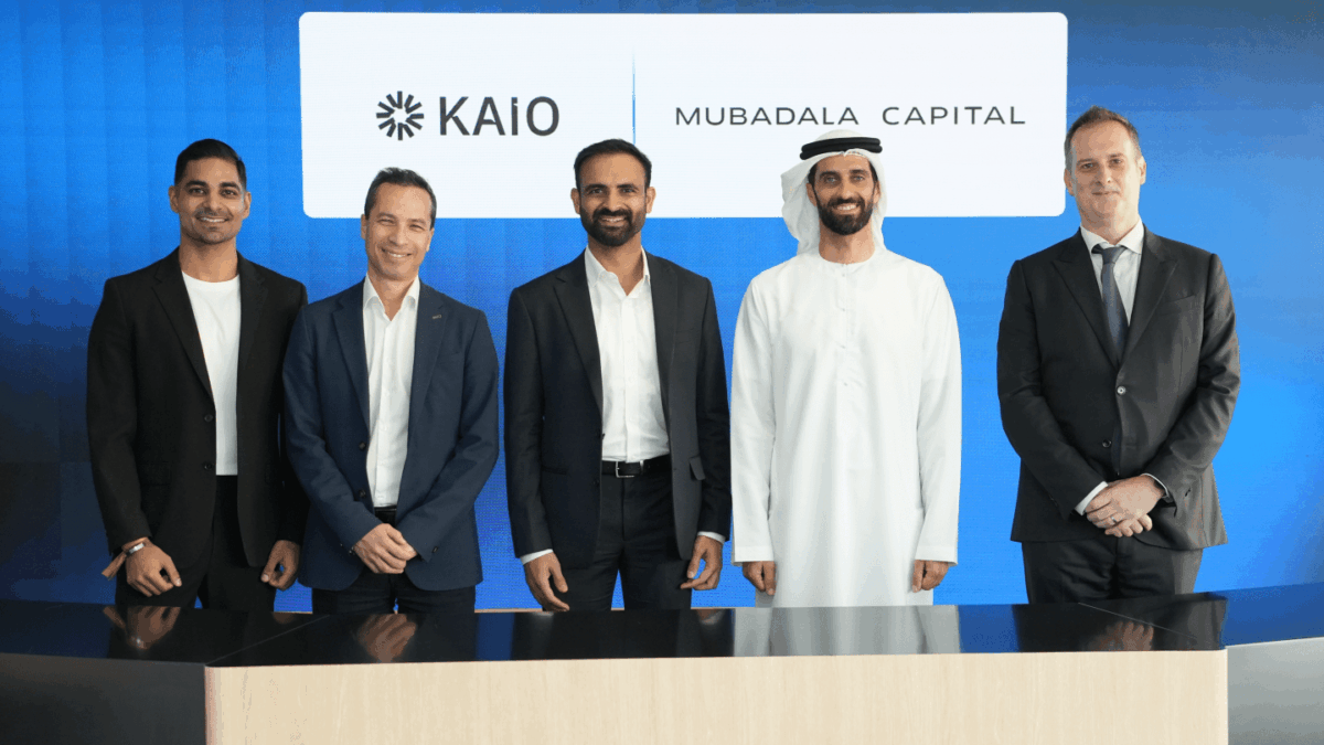 Members of KAIO and Mubadala Capital stand side by side smiling at the camera.