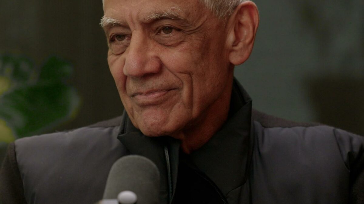 Man stands in front of microphone